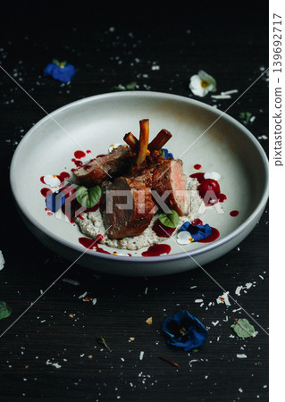Served duck with floral garnish on rustic table Served duck with floral garnish on rustic table 139692717
