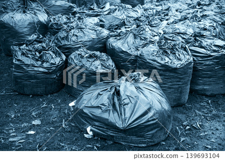 Many garbage bags in the park 139693104