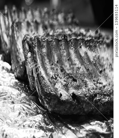 Fried ribs lie on foil Fried ribs lie on foil 139693114