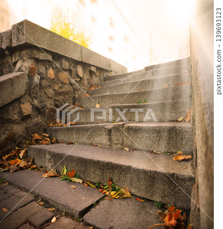 Old stone stairs in city park 139693123