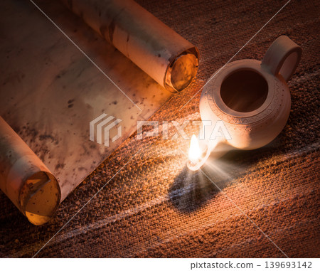 Old oil lamp and scroll Old oil lamp and scroll 139693142