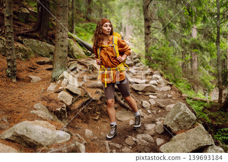 Young woman with backpack traveling outdoors. Hiking, active lifestyle. Young woman with backpack traveling outdoors. Hiking, active lifestyle. 139693184