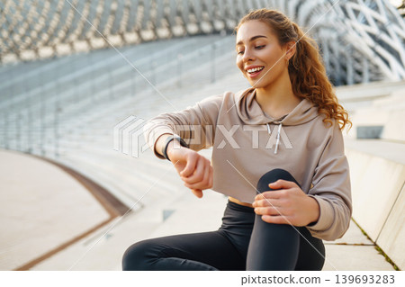 A young female athlete in special clothing is training on the court. Concept of sport, health. A young female athlete in special clothing is training on the court. Concept of sport, health. 139693283