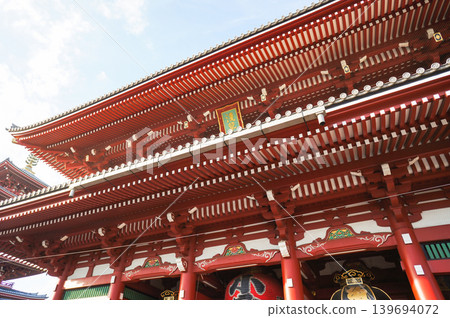 The magnificent vermilion Kaminarimon Gate of Senso-ji Temple is a traditional architectural masterpiece. The magnificent vermilion Kaminarimon Gate of Senso-ji Temple is a traditional architectural masterpiece. 139694072