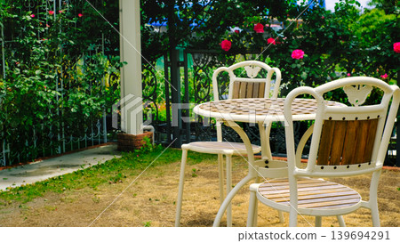 A scene with garden chairs 139694291