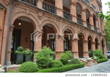 Red brick arched corridor 139694502