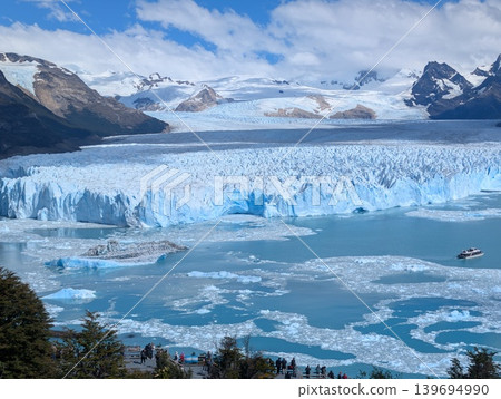Los Glaciares National Park, Santa Cruz Province, Argentina - March 10, 2026: Tourists enjoy stunning views of the Andes, the Perito Moreno Glacier, and a lake with icebergs Los Glaciares National Park, Santa Cruz Province, Argentina - March 10, 2026: Tourists enjoy stunning views of the Andes, the Perito Moreno Glacier, and a lake with icebergs 139694990