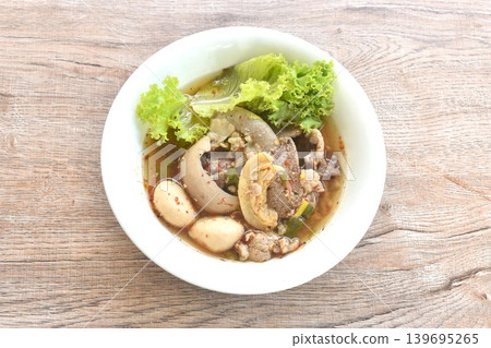 boiled braised pork meatball and tendon couple organ in spicy sour tom yum soup on bowl boiled braised pork meatball and tendon couple organ in spicy sour tom yum soup on bowl 139695265