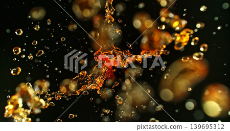 Dramatic liquid splash of oil or gasoline isolated on a black background. Ideal as a realistic VFX overlay effect for cinematic compositing, advertising and action visuals. Dramatic liquid splash of oil or gasoline isolated on a black background. Ideal as a realistic VFX overlay effect for cinematic compositing, advertising and action visuals. 139695312