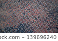 Rusty Diamond Plate Metal Texture With Industrial Wear and Grime Pattern 139696240