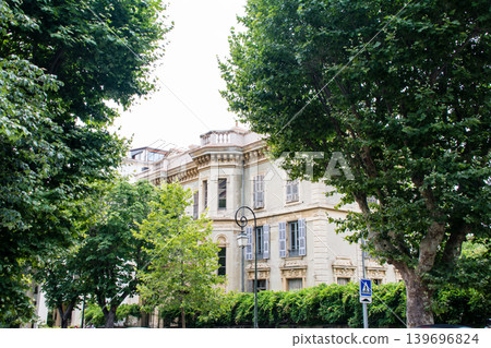 A historic stone building in Ajaccio, Napoleon's birthplace, on the French island of Corsica in the Mediterranean Sea. A historic stone building in Ajaccio, Napoleon's birthplace, on the French island of Corsica in the Mediterranean Sea. 139696824