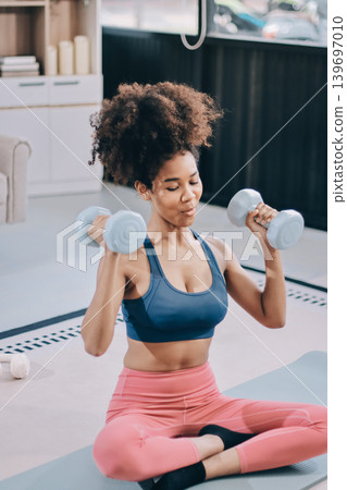 Women exercising in fitness studio yoga classes Women exercising in fitness studio yoga classes 139697010