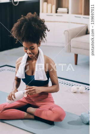 Women exercising in fitness studio yoga classes Women exercising in fitness studio yoga classes 139697011