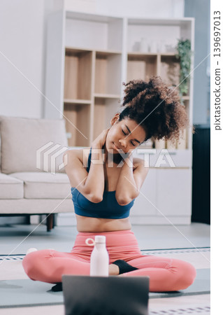 Women exercising in fitness studio yoga classes 139697013