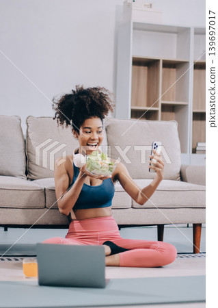 Women exercising in fitness studio yoga classes Women exercising in fitness studio yoga classes 139697017