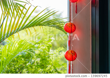 Red traditional Chinese lantern decorated at the wooden arch of the entrance to Lunar New Year festival. Red traditional Chinese lantern decorated at the wooden arch of the entrance to Lunar New Year festival. 139697245
