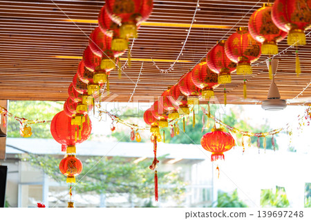 Red traditional Chinese lantern decorated at the wooden arch of the entrance to Lunar New Year festival. 139697248