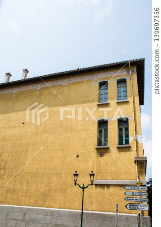 A honey-colored building in Ajaccio, Napoleon's birthplace, on the French island of Corsica in the Mediterranean Sea. 139697356