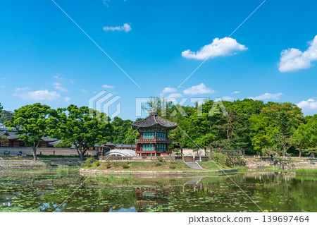 Seoul, South Korea - May. 14, 2026 : Beautiful view of Hyangwonjeong Pavilion and Chhyanggyo Bridge with pond reflection in early summer, Gyeongbokgung Palace, Seoul Seoul, South Korea - May. 14, 2026 : Beautiful view of Hyangwonjeong Pavilion and Chhyanggyo Bridge with pond reflection in early summer, Gyeongbokgung Palace, Seoul 139697464