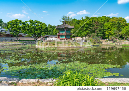 Seoul, South Korea - May. 14, 2026 : Beautiful view of Hyangwonjeong Pavilion and Chhyanggyo Bridge with pond reflection in early summer, Gyeongbokgung Palace, Seoul Seoul, South Korea - May. 14, 2026 : Beautiful view of Hyangwonjeong Pavilion and Chhyanggyo Bridge with pond reflection in early summer, Gyeongbokgung Palace, Seoul 139697466