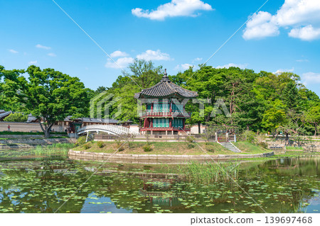 Seoul, South Korea - May. 14, 2026 : Beautiful view of Hyangwonjeong Pavilion and Chhyanggyo Bridge with pond reflection in early summer, Gyeongbokgung Palace, Seoul Seoul, South Korea - May. 14, 2026 : Beautiful view of Hyangwonjeong Pavilion and Chhyanggyo Bridge with pond reflection in early summer, Gyeongbokgung Palace, Seoul 139697468