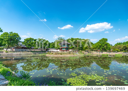 Seoul, South Korea - May. 14, 2026 : Beautiful view of Hyangwonjeong Pavilion and Chhyanggyo Bridge with pond reflection in early summer, Gyeongbokgung Palace, Seoul Seoul, South Korea - May. 14, 2026 : Beautiful view of Hyangwonjeong Pavilion and Chhyanggyo Bridge with pond reflection in early summer, Gyeongbokgung Palace, Seoul 139697469