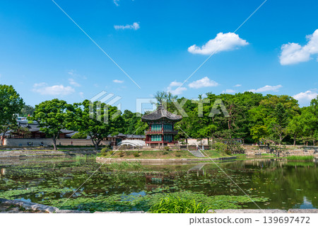Seoul, South Korea - May. 14, 2026 : Beautiful view of Hyangwonjeong Pavilion and Chhyanggyo Bridge with pond reflection in early summer, Gyeongbokgung Palace, Seoul Seoul, South Korea - May. 14, 2026 : Beautiful view of Hyangwonjeong Pavilion and Chhyanggyo Bridge with pond reflection in early summer, Gyeongbokgung Palace, Seoul 139697472