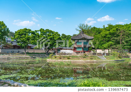 Seoul, South Korea - May. 14, 2026 : Beautiful view of Hyangwonjeong Pavilion and Chhyanggyo Bridge with pond reflection in early summer, Gyeongbokgung Palace, Seoul Seoul, South Korea - May. 14, 2026 : Beautiful view of Hyangwonjeong Pavilion and Chhyanggyo Bridge with pond reflection in early summer, Gyeongbokgung Palace, Seoul 139697473