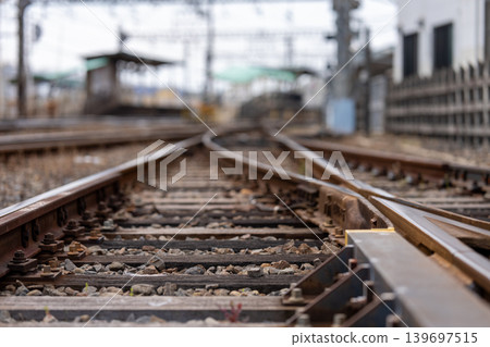 A low-angle view of railway tracks and junctions. A low-angle view of railway tracks and junctions. 139697515