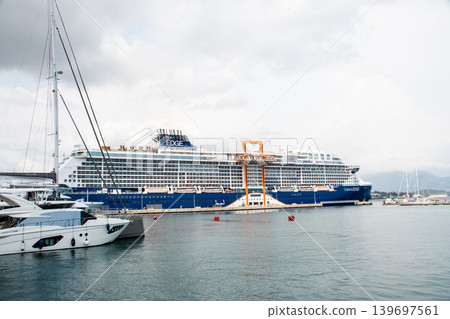 A large cruise ship docked in the port of Ajaccio, Napoleon's birthplace, on the French island of Corsica in the Mediterranean Sea. A large cruise ship docked in the port of Ajaccio, Napoleon's birthplace, on the French island of Corsica in the Mediterranean Sea. 139697561