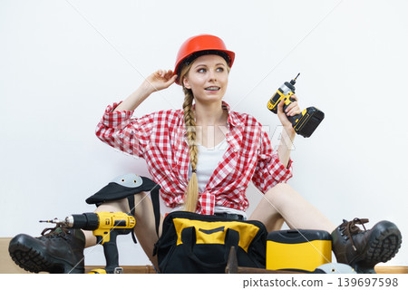 Woman constructive worker with tool bag Woman constructive worker with tool bag 139697598