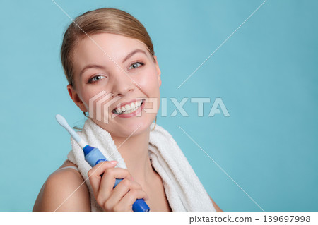 Young girl brushing oral cavity. Young girl brushing oral cavity. 139697998