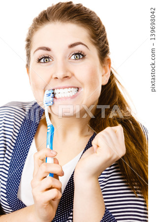 Woman brushing cleaning teeth. Woman brushing cleaning teeth. 139698042