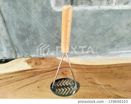Stainless Steel Potato Masher with Wooden Handle Stainless Steel Potato Masher with Wooden Handle 139698103