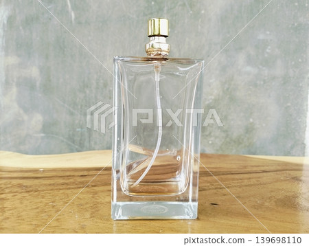 Empty Perfume Bottle on Wooden Texture Background Empty Perfume Bottle on Wooden Texture Background 139698110