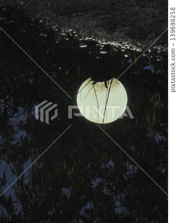 Spherical street lamp glowing at night. Spherical street lamp glowing at night. 139698258