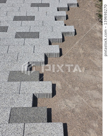 Process of laying concrete paving blocks. Process of laying concrete paving blocks. 139698270
