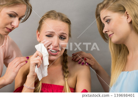 Friends helping sad woman 139698401