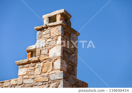 Stone amde chimney on roof Stone amde chimney on roof 139698454