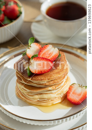 Pancakes with Strawberries and Coffee. Breakfast on Sunny Morning Pancakes with Strawberries and Coffee. Breakfast on Sunny Morning 139698623