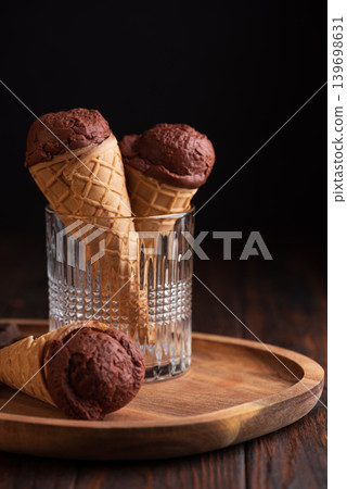 Chocolate Ice Cream Cones with Dark Chocolate on Dark Wooden Background 139698631