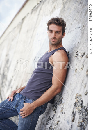 Fashion, serious and portrait of man by rock in trendy clothes, casual style and outfit in nature. Masculine, sexy model and attractive person by wall with confidence, pride and stylish on weekend Fashion, serious and portrait of man by rock in trendy clothes, casual style and outfit in nature. Masculine, sexy model and attractive person by wall with confidence, pride and stylish on weekend 139698660