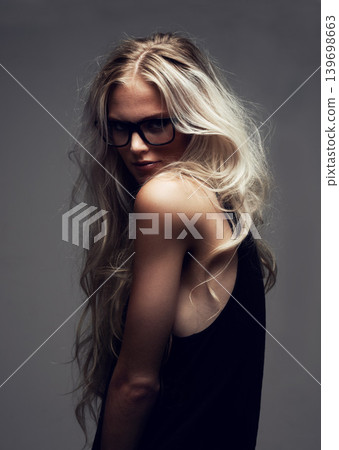 Portrait, woman and glasses in studio with fashion, style and trendy aesthetic with positive by gray background. Model, pride and eyecare on face with attitude, blonde and cool in sunglasses Portrait, woman and glasses in studio with fashion, style and trendy aesthetic with positive by gray background. Model, pride and eyecare on face with attitude, blonde and cool in sunglasses 139698663