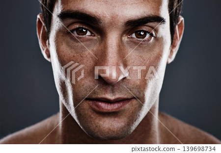 Portrait, skincare and man with cosmetics, glow and grooming on grey studio background. Person, guy and model with routine or treatment with beauty and shine with beauty, wellness or dermatology Portrait, skincare and man with cosmetics, glow and grooming on grey studio background. Person, guy and model with routine or treatment with beauty and shine with beauty, wellness or dermatology 139698734