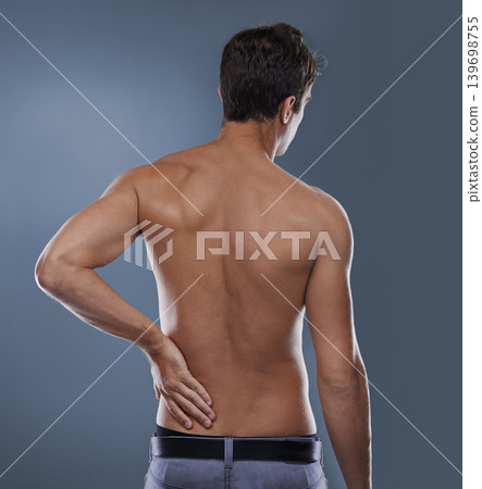 Back pain, injury crisis and studio person with medical emergency, sore spine or osteoporosis. Backache, arthritis and model massage joint ache, accident or hurt muscle strain on grey background Back pain, injury crisis and studio person with medical emergency, sore spine or osteoporosis. Backache, arthritis and model massage joint ache, accident or hurt muscle strain on grey background 139698755