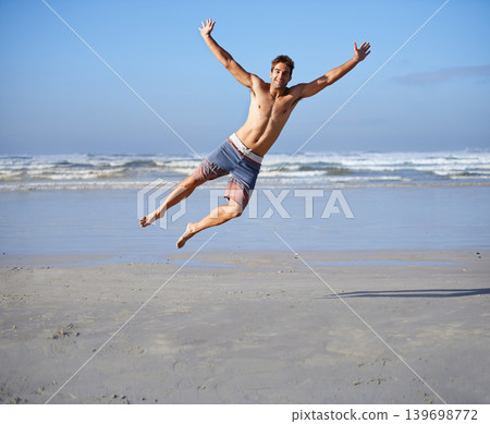 Man, jumping and portrait for happiness at beach, outdoor fun and happy in summer on vacation. Young person, playing and leisure on holiday by sea, freedom and energy for travel adventure by waves Man, jumping and portrait for happiness at beach, outdoor fun and happy in summer on vacation. Young person, playing and leisure on holiday by sea, freedom and energy for travel adventure by waves 139698772