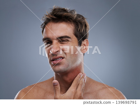 Man, shave and rash pain from razor burn for hair removal for hygiene maintenance, mistake or grey background. Male person, hand and unhappy in studio or care fail in inflammation, itchy or mockup Man, shave and rash pain from razor burn for hair removal for hygiene maintenance, mistake or grey background. Male person, hand and unhappy in studio or care fail in inflammation, itchy or mockup 139698791