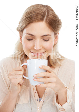 Relax, smile and woman with coffee in studio for break, aroma or peaceful moment on white background. Tea, face and happy female model with hot drink for comfort, scent or caffeine satisfaction Relax, smile and woman with coffee in studio for break, aroma or peaceful moment on white background. Tea, face and happy female model with hot drink for comfort, scent or caffeine satisfaction 139698829
