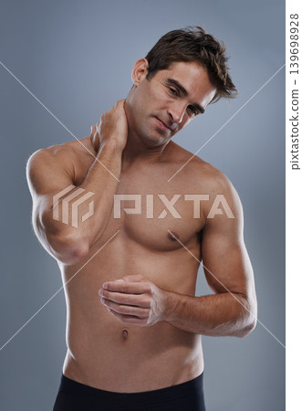 Neck pain, studio and man with injury problem, medical emergency and massage muscle pressure. Inflammation, fibromyalgia or sore person with nerve tension, accident or hurt anatomy on grey background Neck pain, studio and man with injury problem, medical emergency and massage muscle pressure. Inflammation, fibromyalgia or sore person with nerve tension, accident or hurt anatomy on grey background 139698928