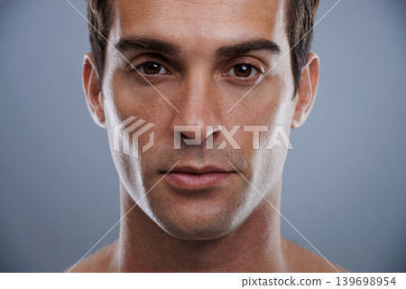 Portrait, skincare and man with dermatology, wellness and confident guy on grey studio background. Face, person and model with beauty and grooming with routine and cosmetics with glow and aesthetic Portrait, skincare and man with dermatology, wellness and confident guy on grey studio background. Face, person and model with beauty and grooming with routine and cosmetics with glow and aesthetic 139698954